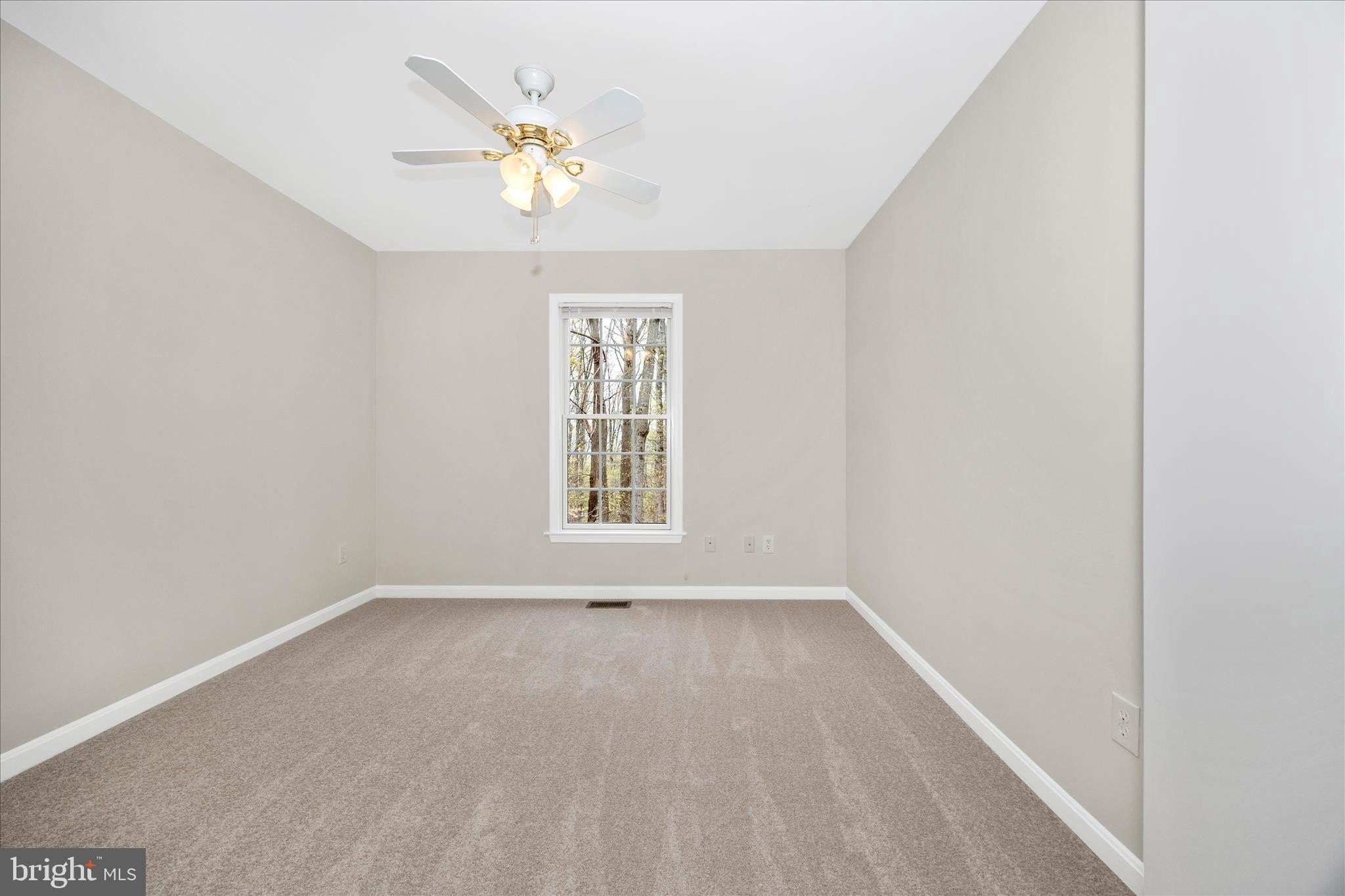 10393 Liberty Road Frederick, MD 21701 - Photo 35 of 47 an empty room with a window and a fan