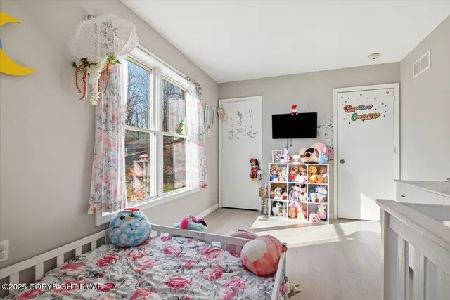 a bathroom with a sink vanity tub and mirror