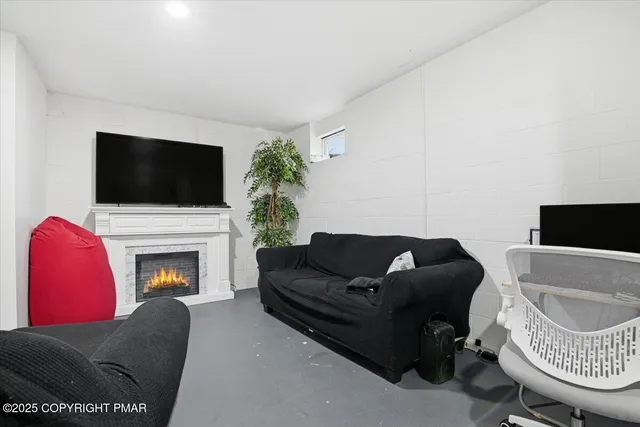 a view of a house with a large tree