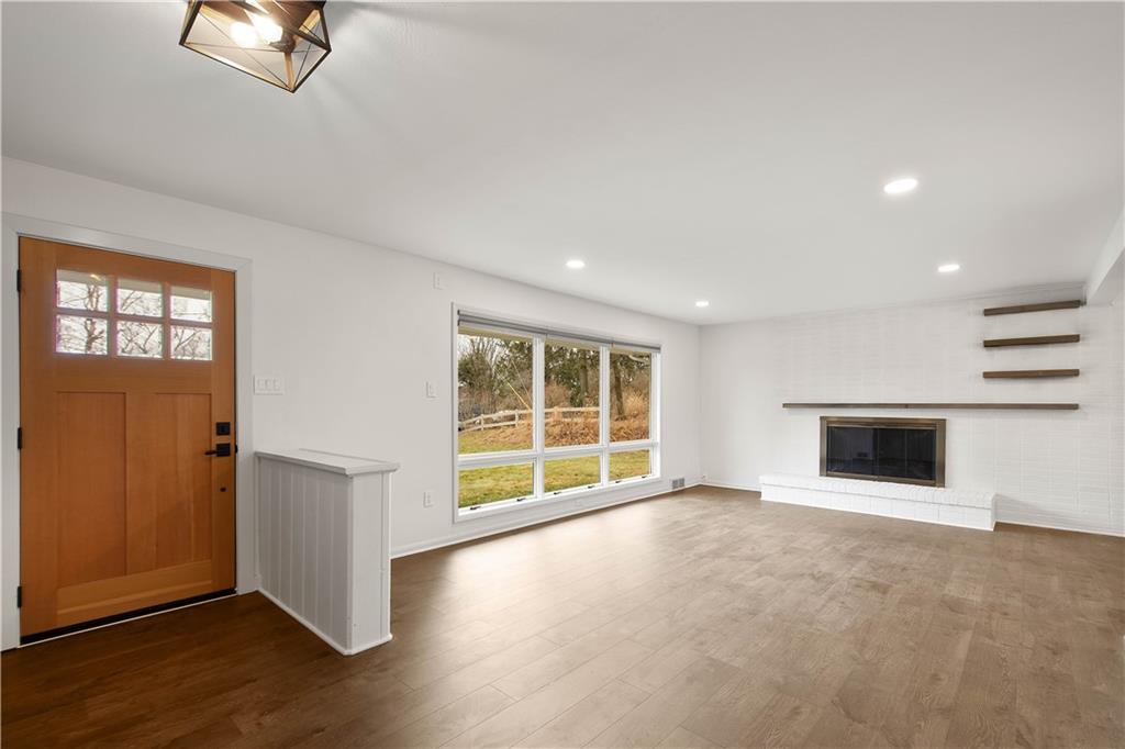 167 South McCoy Pl Road Sewickley, PA 15143 - Photo 9 of 38 The Living Room Features New Lux Vinyl Flooring