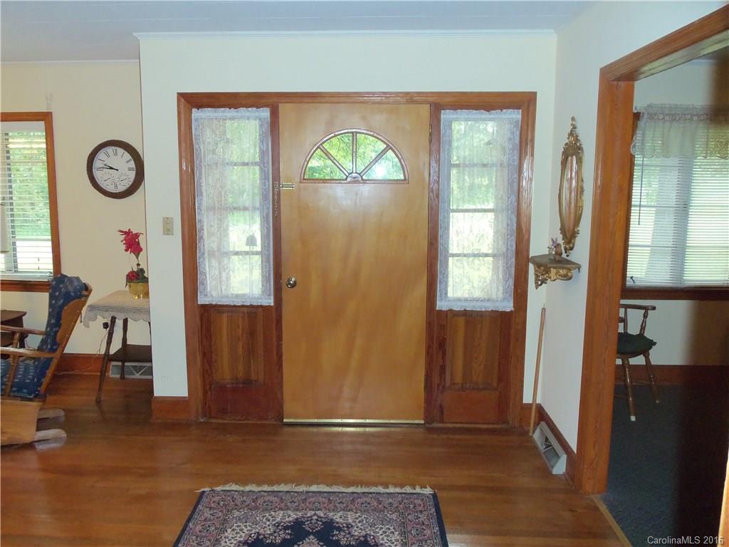 1216 Tom Helms Road Monroe, NC 28110 - Photo 3 of 23 a view of an entryway with wooden floor and a front door