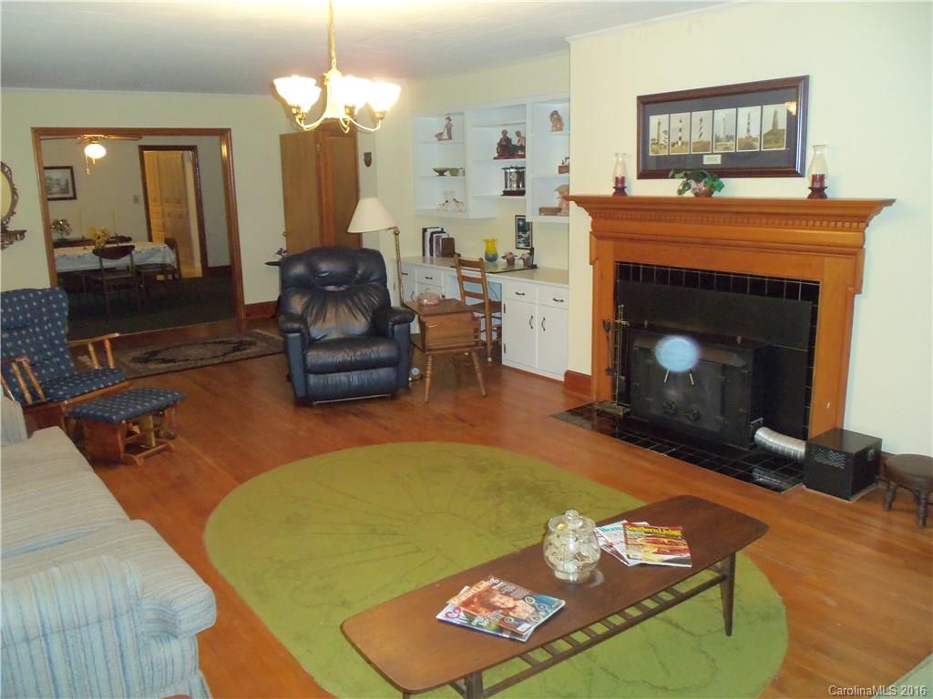 1216 Tom Helms Road Monroe, NC 28110 - Photo 5 of 23 a living room with furniture and a fireplace