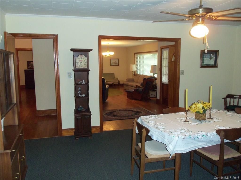 1216 Tom Helms Road Monroe, NC 28110 - Photo 8 of 23 a view of a dining room with furniture and wooden floor
