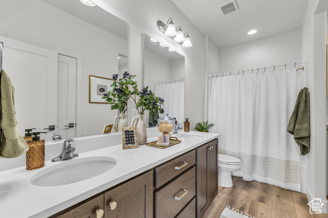 155 East 360th Street East, Unit 10B Fillmore, UT 84631 - Photo 21 of 43 Full bathroom featuring vanity, wood-type flooring, shower / bath combo, and toilet