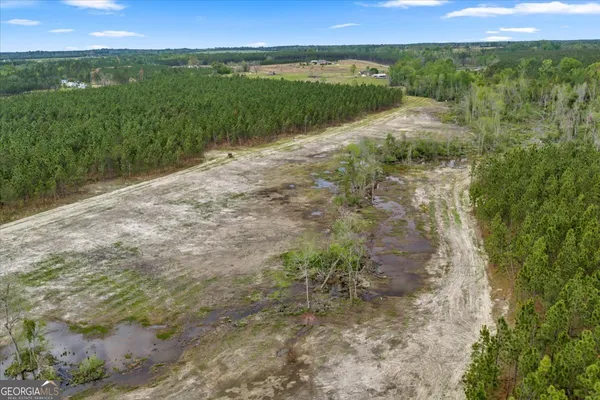 an aerial view of a house with a lake view