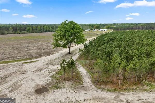 a view of a lake with a yard