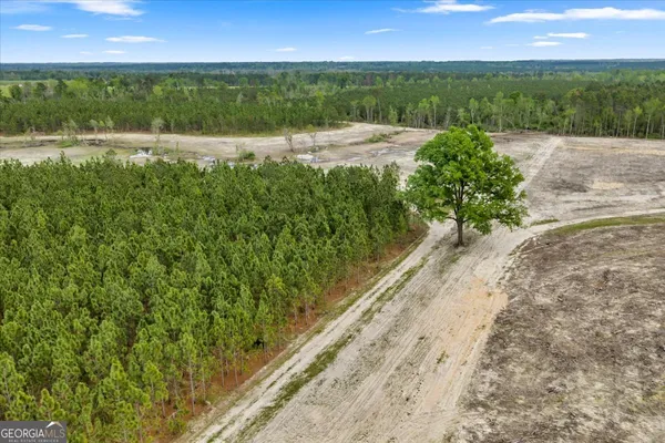 a view of a lake with a yard