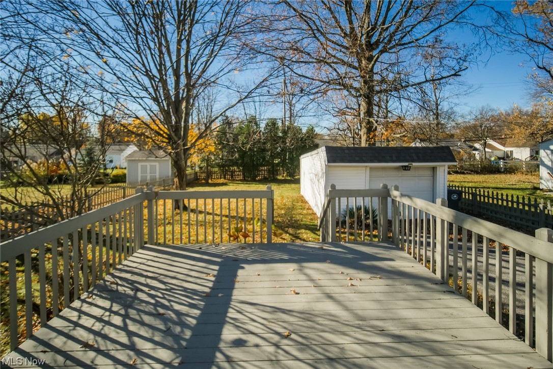 1668 Winchester Road Cleveland, OH 44124 - Photo 19 of 20 Wooden terrace with a storage shed and a garage