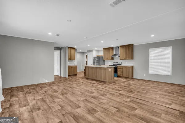 a kitchen with a refrigerator and a sink