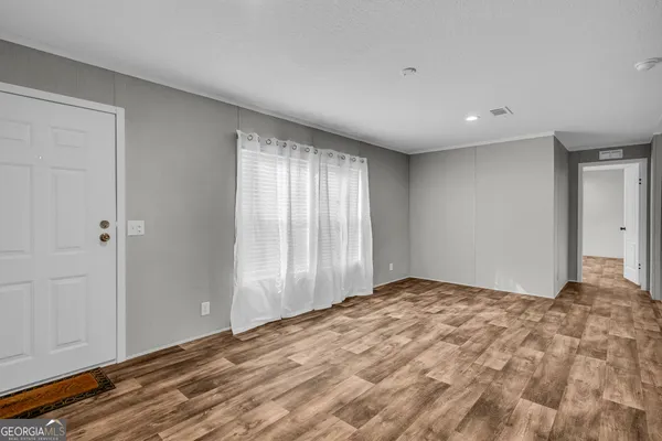 a kitchen with granite countertop stainless steel appliances a stove top oven a sink a counter space and cabinets