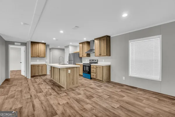 a kitchen with appliances cabinets and a counter top space
