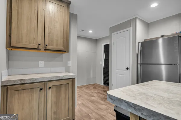 a kitchen with sink and natural light