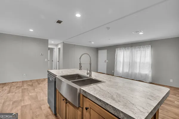 a view of an empty room and wooden floor