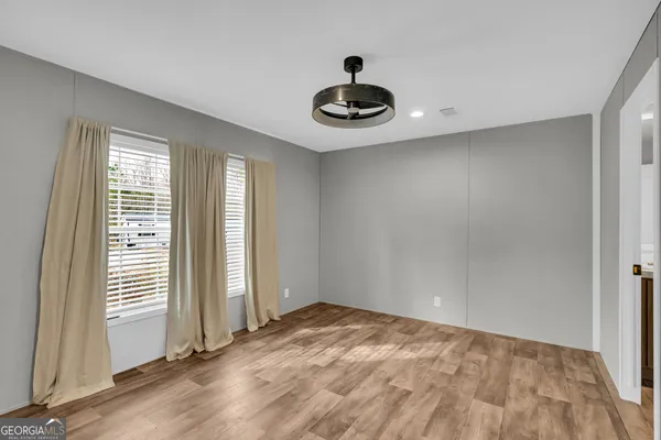 a view of an empty room and window