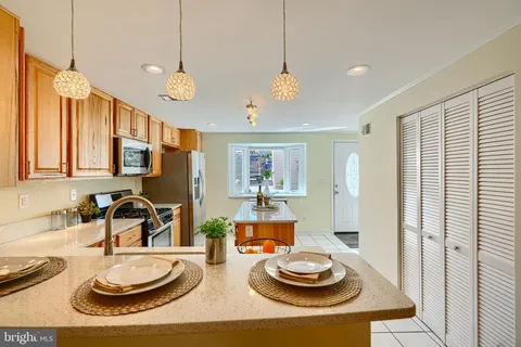 a kitchen with a table and a stove