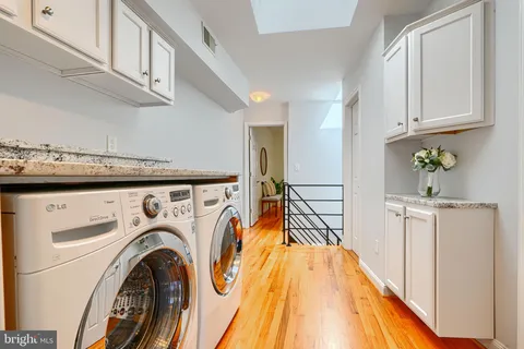 a view of a kitchen with washer and dryer