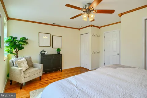 a bedroom with a bed and a couch