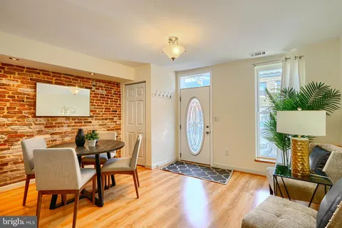 a view of a livingroom with furniture and a window