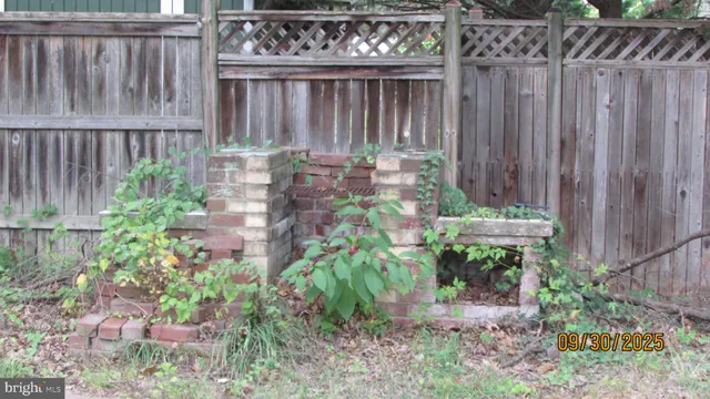 a garden with wooden fence