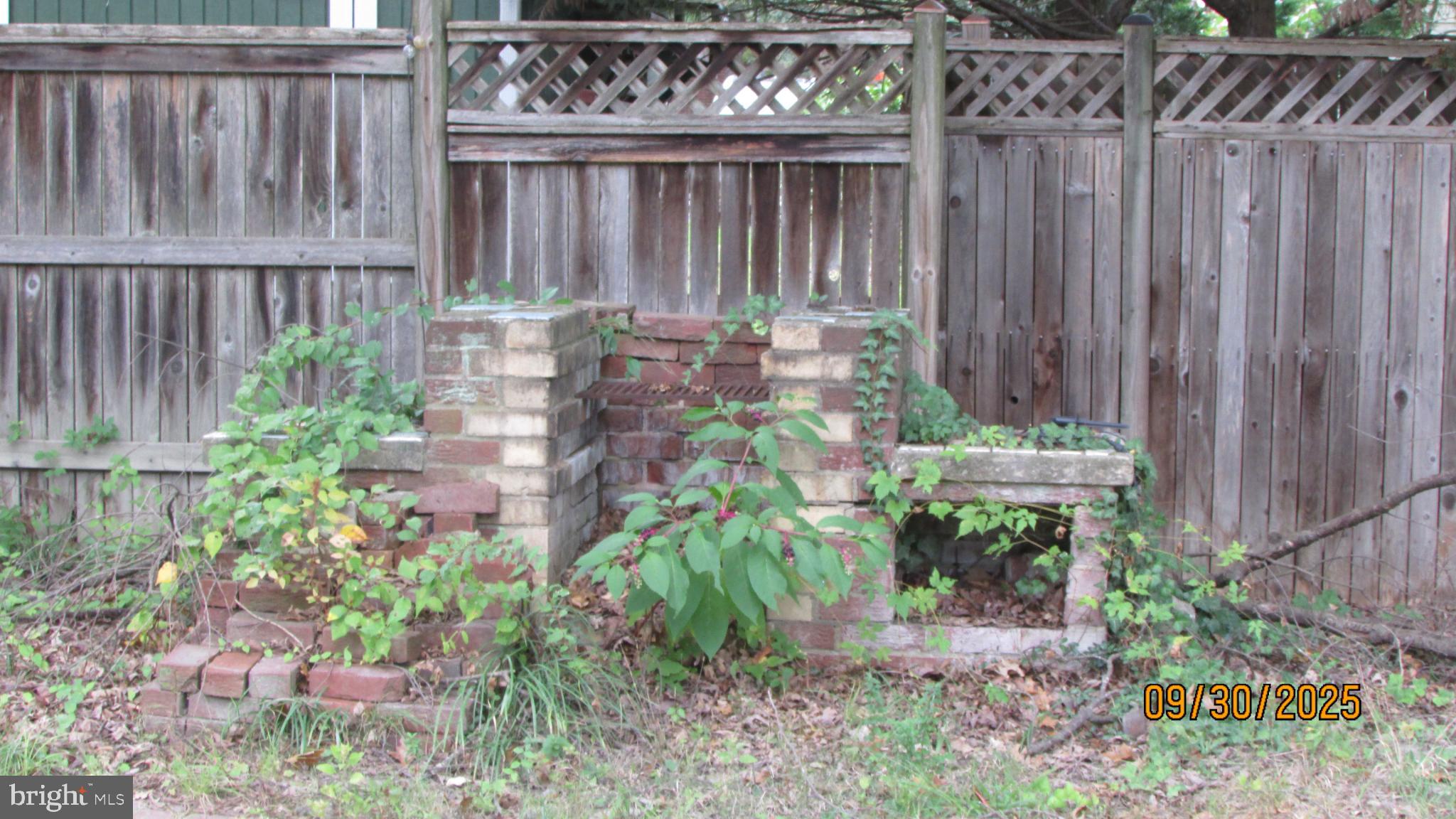 4614 Beechwood Road College Park, MD 20740 - Photo 5 of 11 Overgrown remnants of a brick structure.