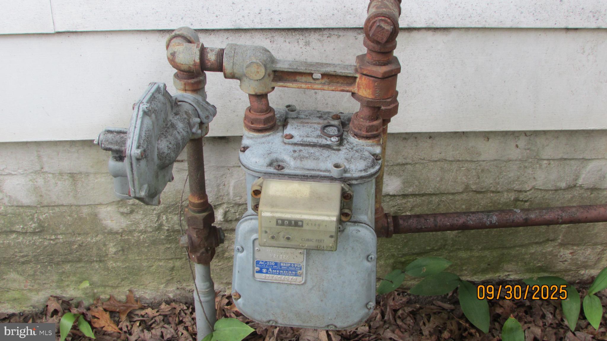 4614 Beechwood Road College Park, MD 20740 - Photo 9 of 11 Old gas meter with rusted pipes.