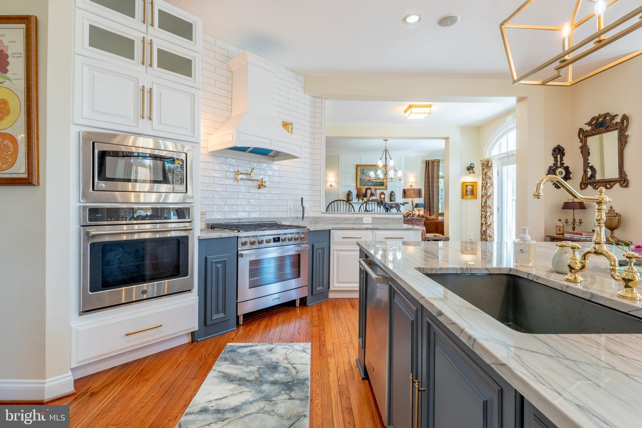 96 Colony Crossing Edgewater, MD 21037 - Photo 7 of 53 a kitchen with stainless steel appliances granite countertop a sink and stove top oven
