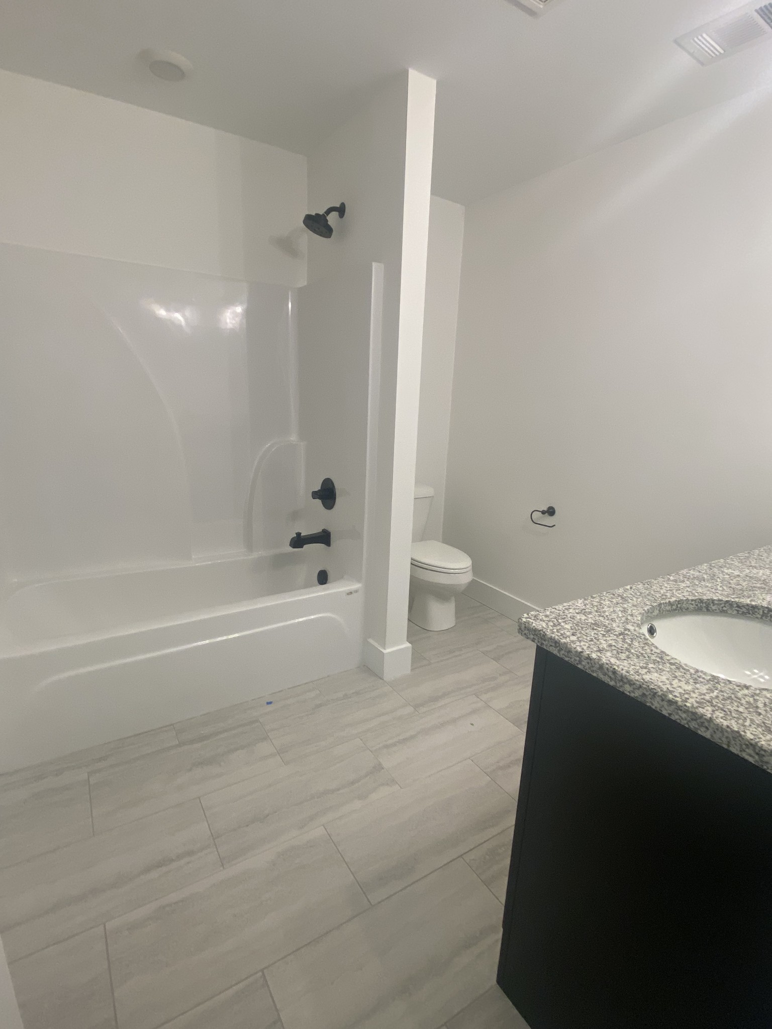 2175 Rylee Way Greenbrier, TN 37073 - Photo 13 of 17 a bathroom with a granite countertop sink and mirror with toilet