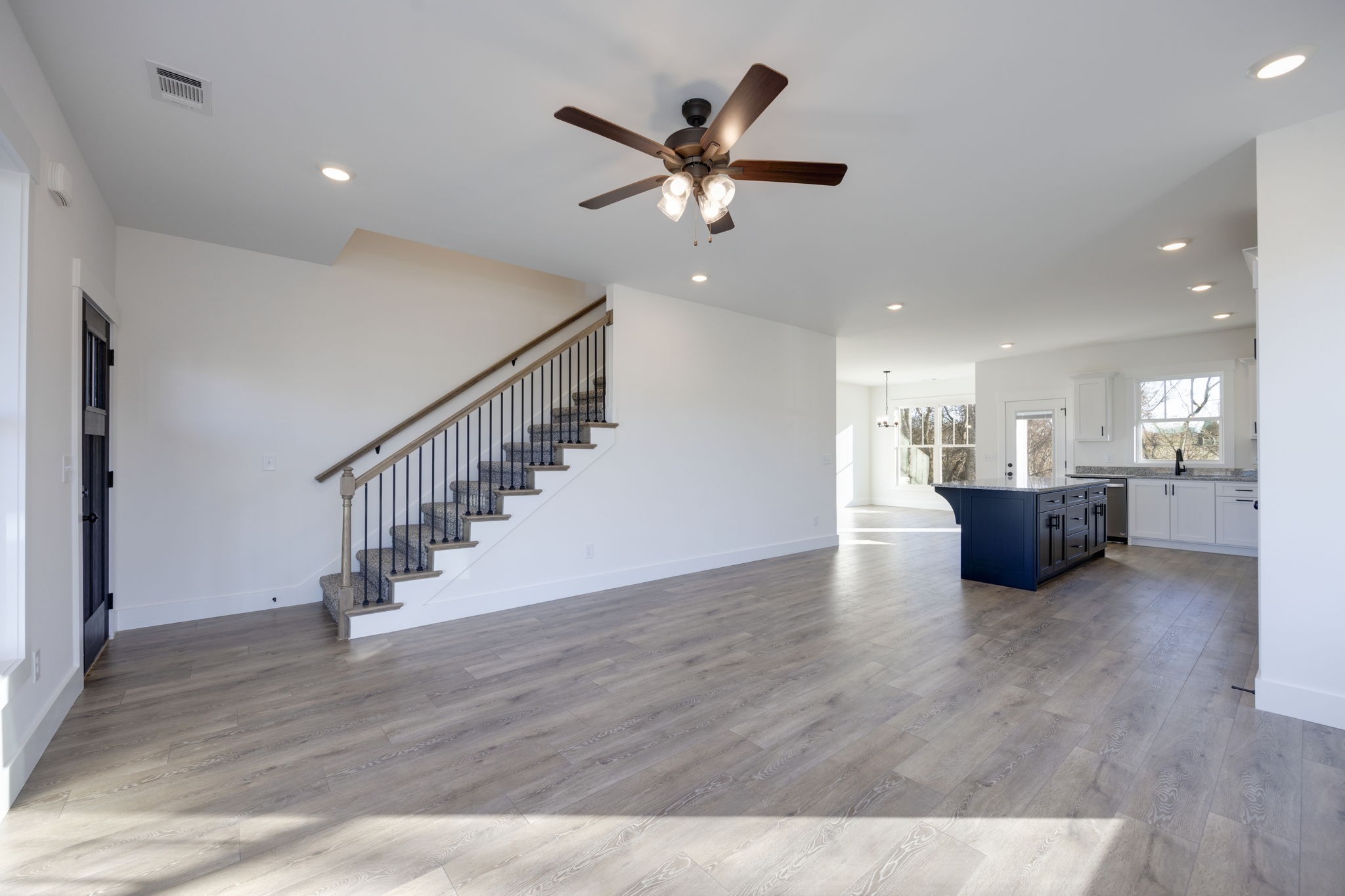 2175 Rylee Way Greenbrier, TN 37073 - Photo 5 of 17 a view of a livingroom with a kitchen and wooden floor