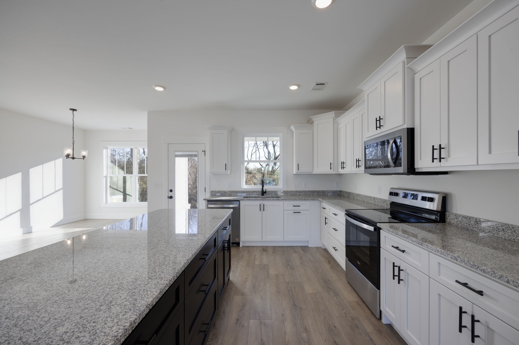 2175 Rylee Way Greenbrier, TN 37073 - Photo 6 of 17 a large kitchen with granite countertop a large counter top space a sink stainless steel appliances and cabinets