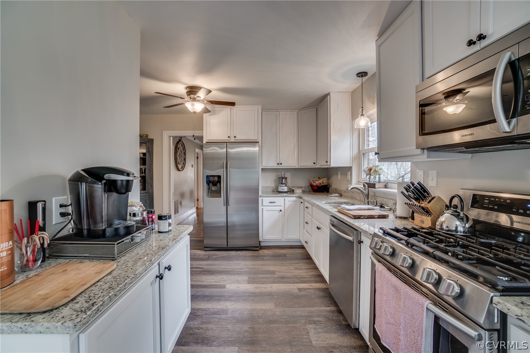 58 Alleghany Road Hampton, VA 23661 - Photo 12 of 39 a kitchen with a stove sink and refrigerator