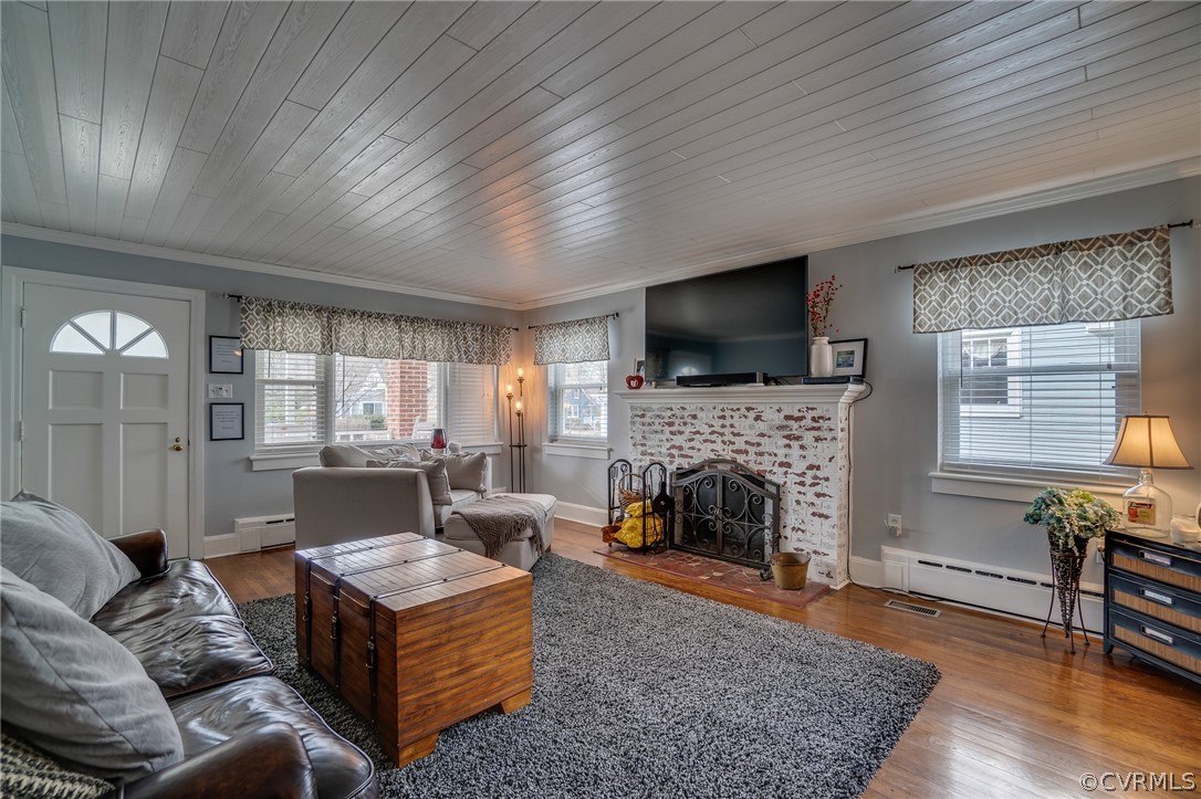58 Alleghany Road Hampton, VA 23661 - Photo 5 of 39 a living room with furniture a fireplace and a flat screen tv