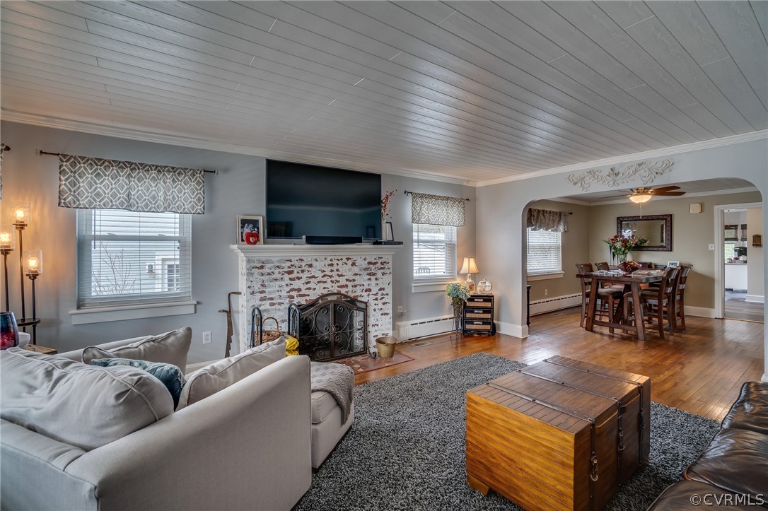 58 Alleghany Road Hampton, VA 23661 - Photo 6 of 39 a living room with furniture a fireplace and a flat screen tv