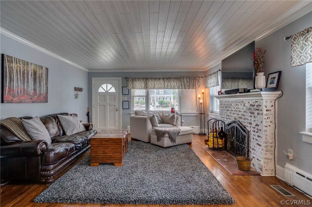 58 Alleghany Road Hampton, VA 23661 - Photo 7 of 39 a living room with furniture a flat screen tv and a fireplace