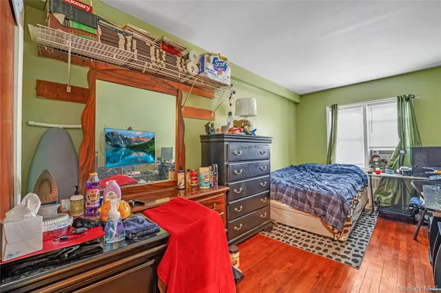 a bedroom with a bed and a table in it