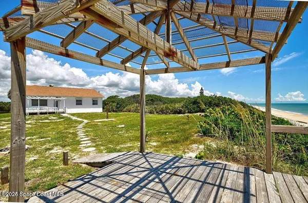 a view of a balcony with a ocean view