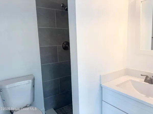 a bathroom with a toilet and a sink