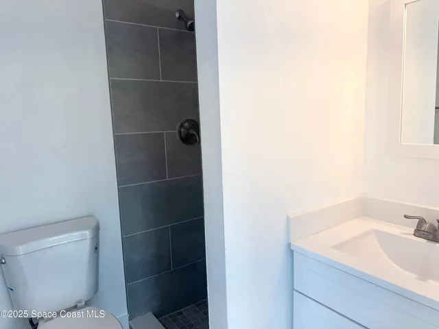 a bathroom with a toilet and a sink
