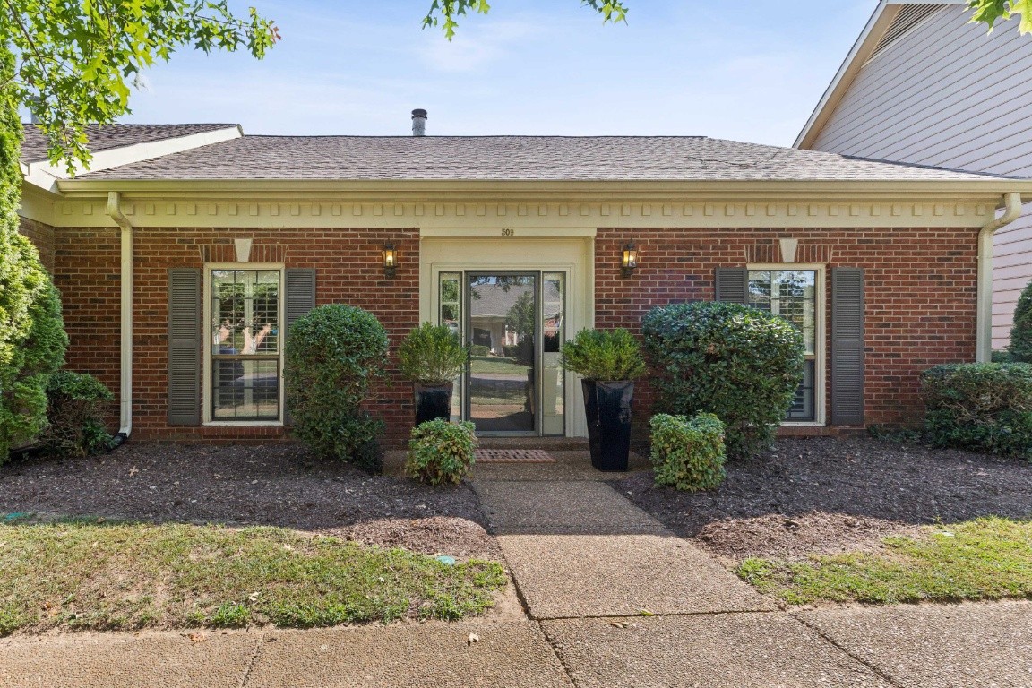 509 General George Patton Road Nashville, TN 37221 - Photo 1 of 25 a front view of a house with garden