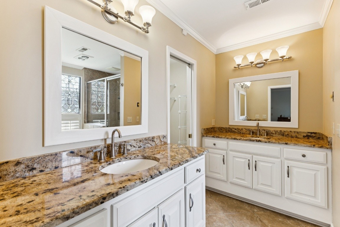 509 General George Patton Road Nashville, TN 37221 - Photo 18 of 25 a bathroom with a granite countertop sink double and mirror