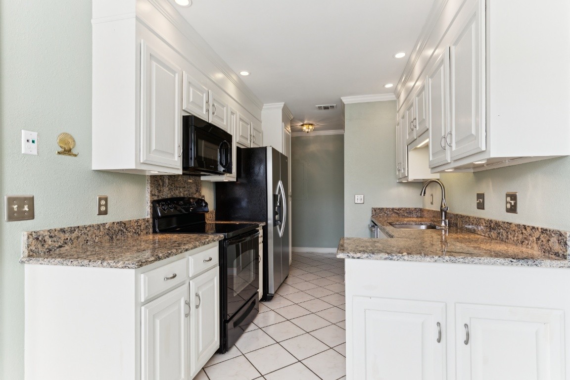 509 General George Patton Road Nashville, TN 37221 - Photo 5 of 25 a kitchen with stainless steel appliances granite countertop a sink stove and refrigerator