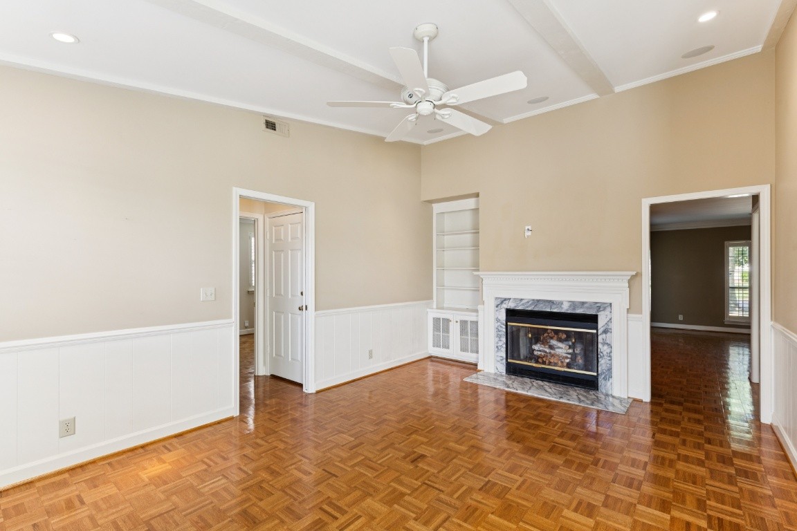 509 General George Patton Road Nashville, TN 37221 - Photo 7 of 25 an empty room with wooden floor fireplace and windows
