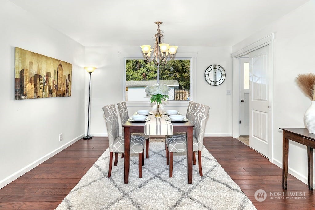 10050 Southeast 190th Street Renton, WA 98055 - Photo 5 of 27 a view of a dining room with furniture window and wooden floor