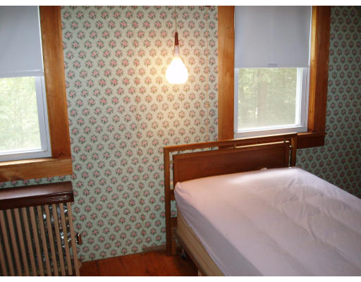 47 Route 20 Chester, MA 01011 - Photo 15 of 19 a bedroom with a bed and a window