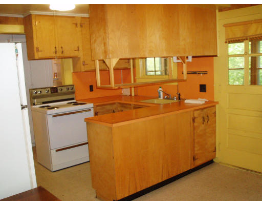 47 Route 20 Chester, MA 01011 - Photo 9 of 19 a utility room with stainless steel appliances a stove a microwave and a refrigerator