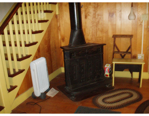 47 Route 20 Chester, MA 01011 - Photo 10 of 19 a living room with a furniture and a fireplace