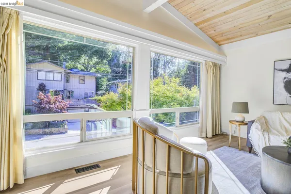 a view of a living room and a window in the living room