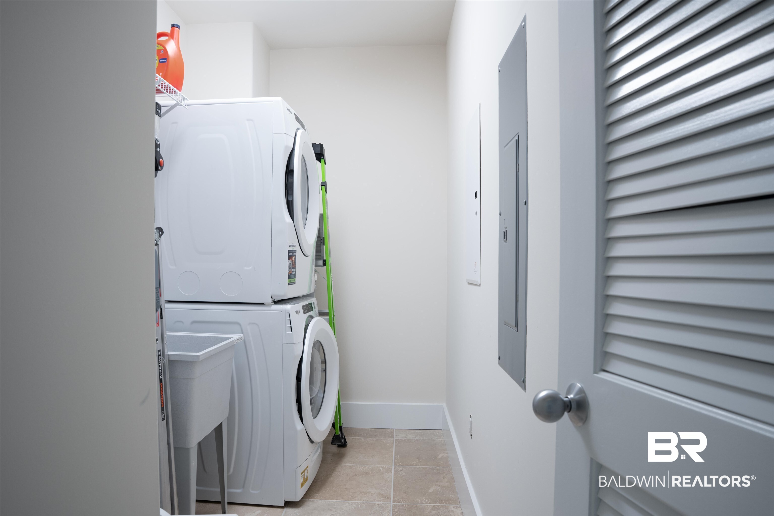 28107 Perdido Beach Boulevard, Unit DPH05 Orange Beach, AL 36561 - Photo 18 of 43 Laundry room with stacked washer / dryer and electric panel