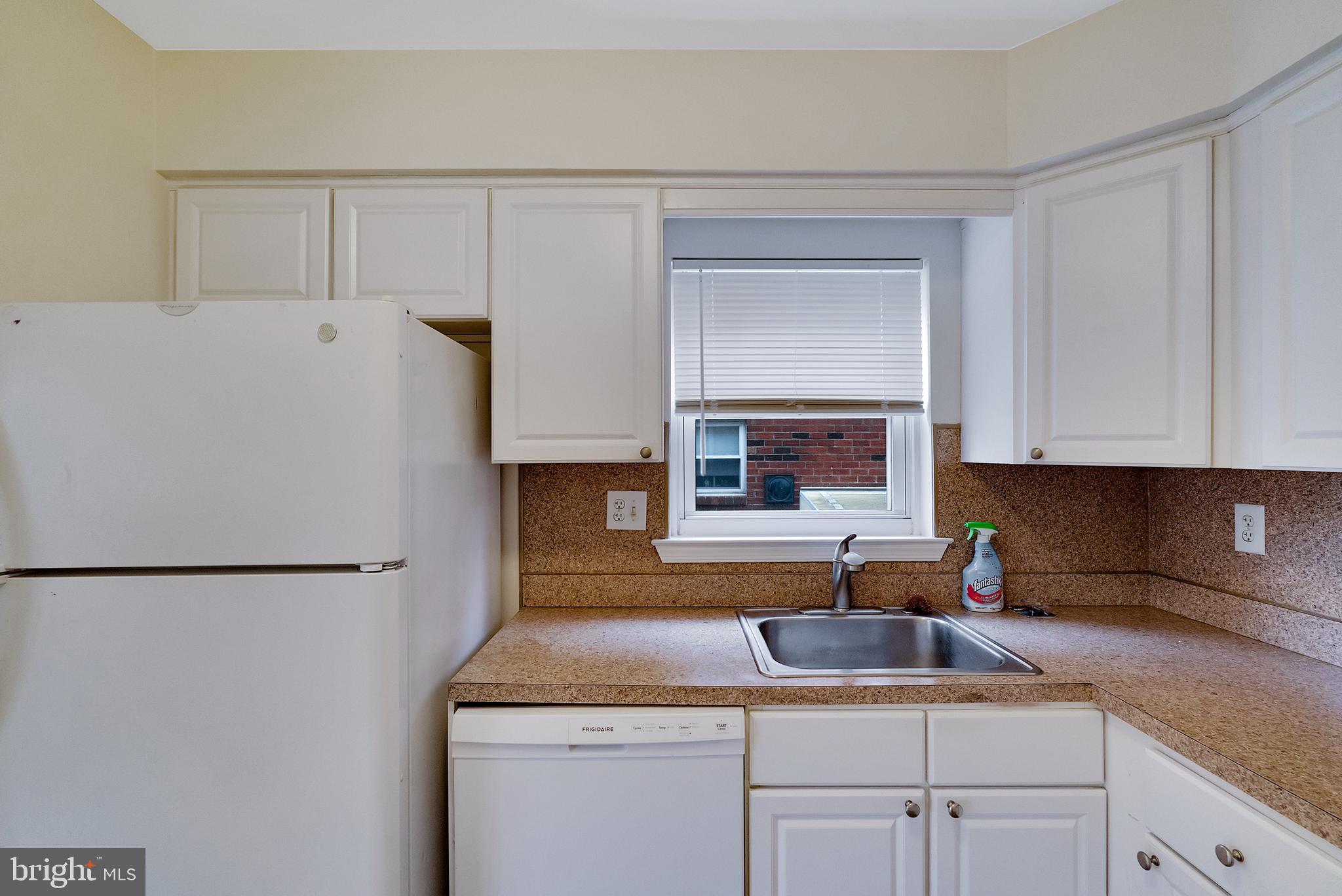 9754 East Roosevelt Boulevard, Unit 1 Philadelphia, PA 19115 - Photo 13 of 30 a kitchen with a sink and cabinets