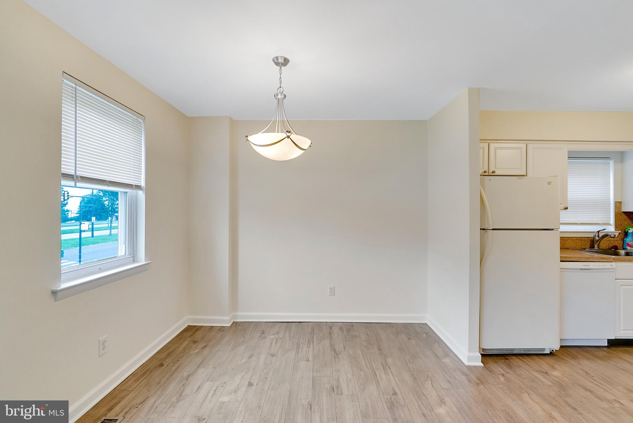 9754 East Roosevelt Boulevard, Unit 1 Philadelphia, PA 19115 - Photo 6 of 30 a view of empty room with wooden floor and window