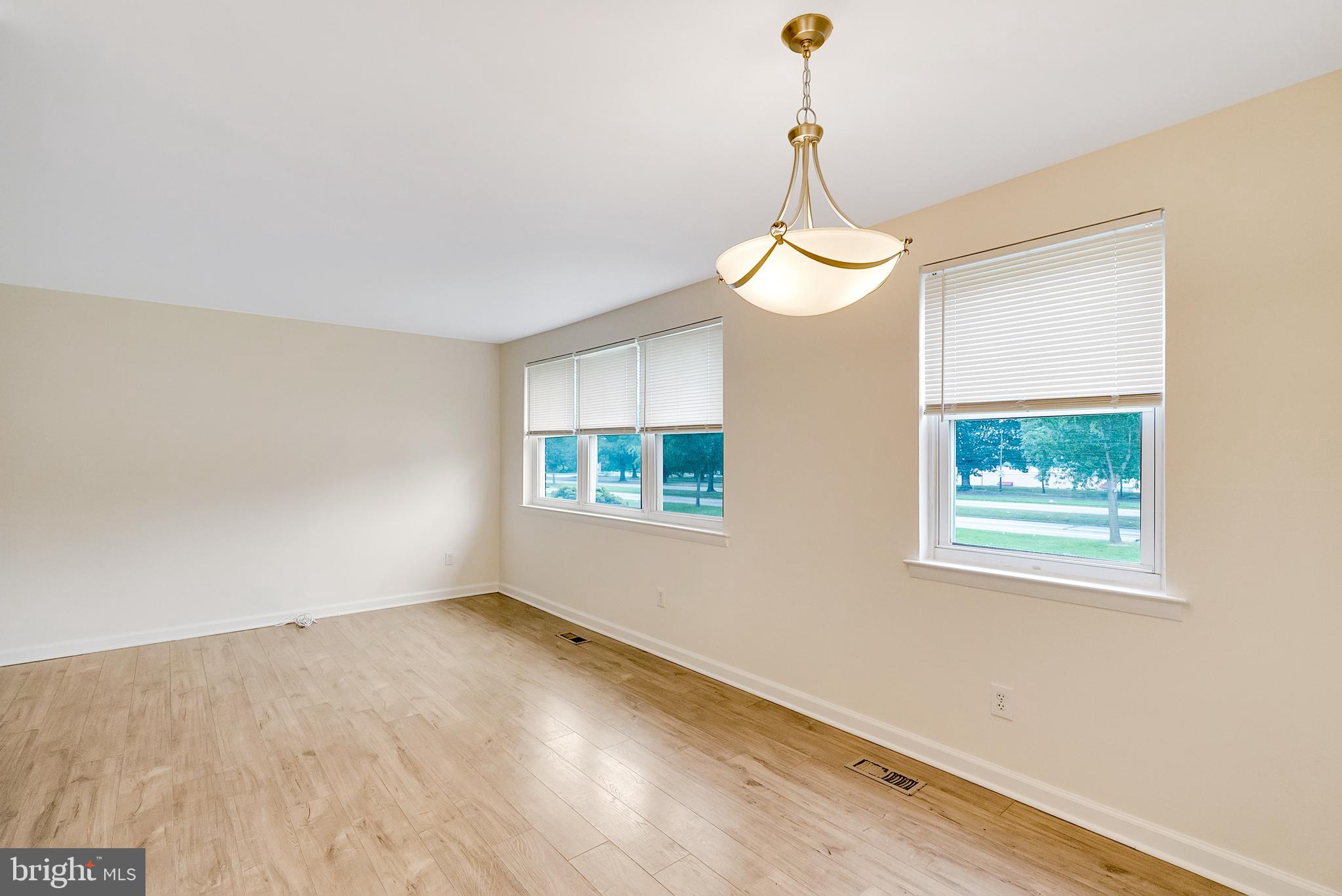 9754 East Roosevelt Boulevard, Unit 1 Philadelphia, PA 19115 - Photo 7 of 30 a view of a room with a window and wooden floor